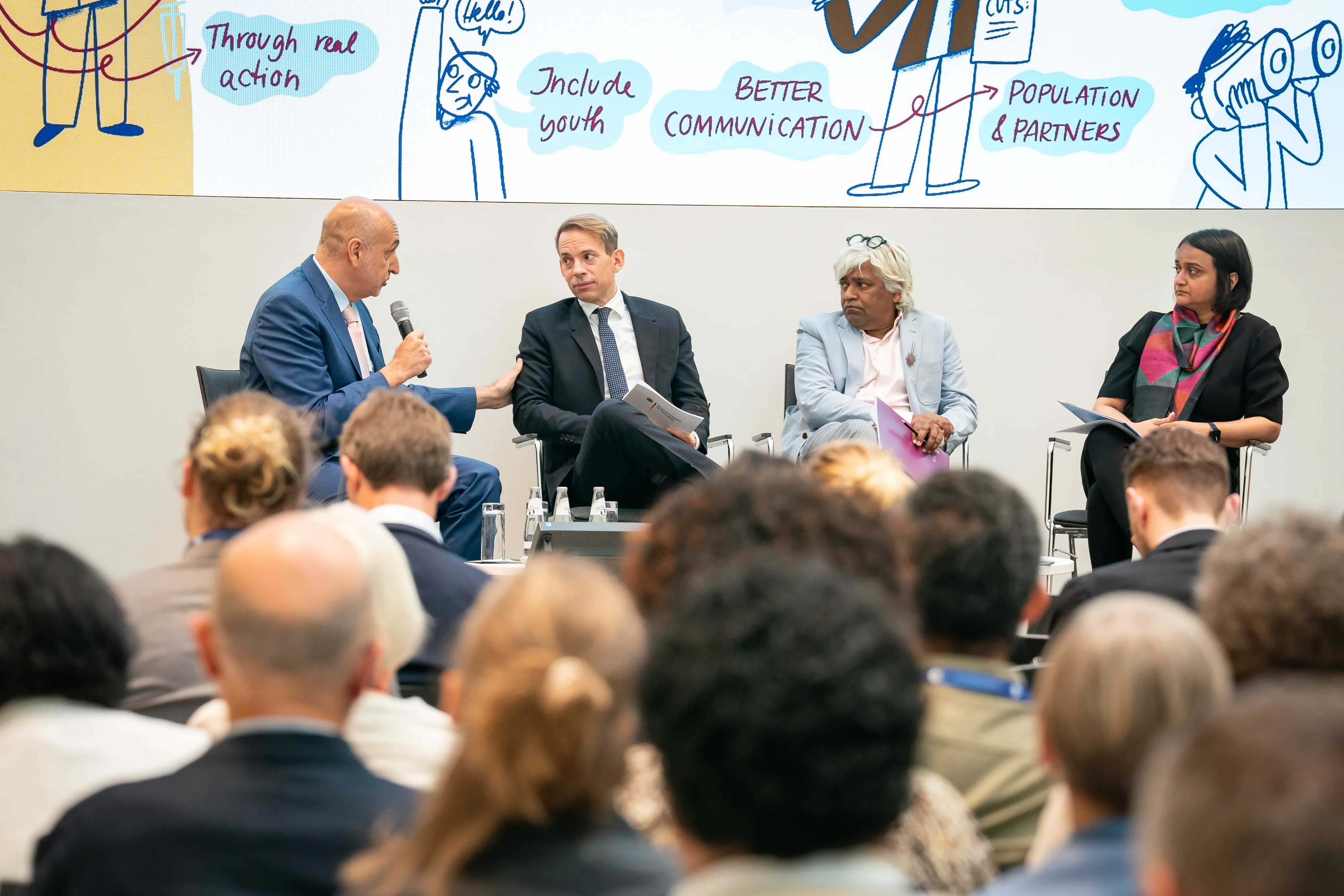 ©GIZ/Thomas Ecke. From the left Dr. Francisco Pérez-Cañado, Paul Zubeil, Dr. Unni Karunakara, Dr. Revati Phalkey
